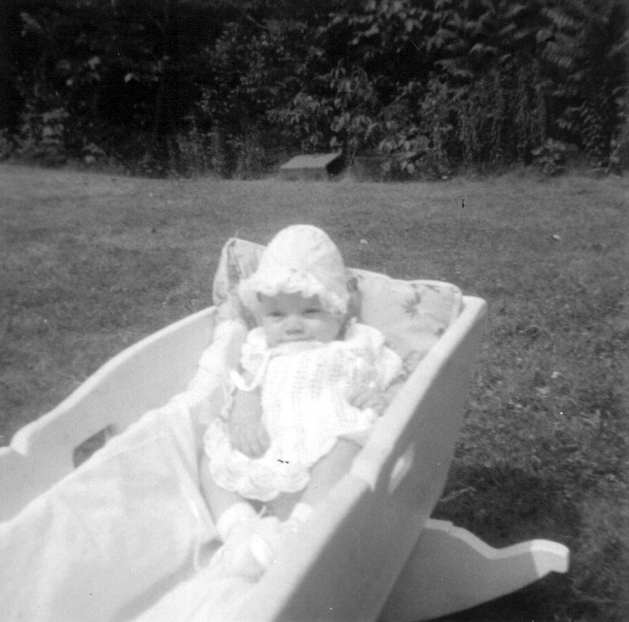 Kathy in Grandpa Kenneth Flick’s Cradle